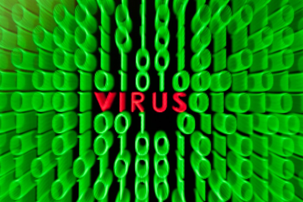 Illustration - Computervirus. Foto: Sebastian Kahnert/dpa