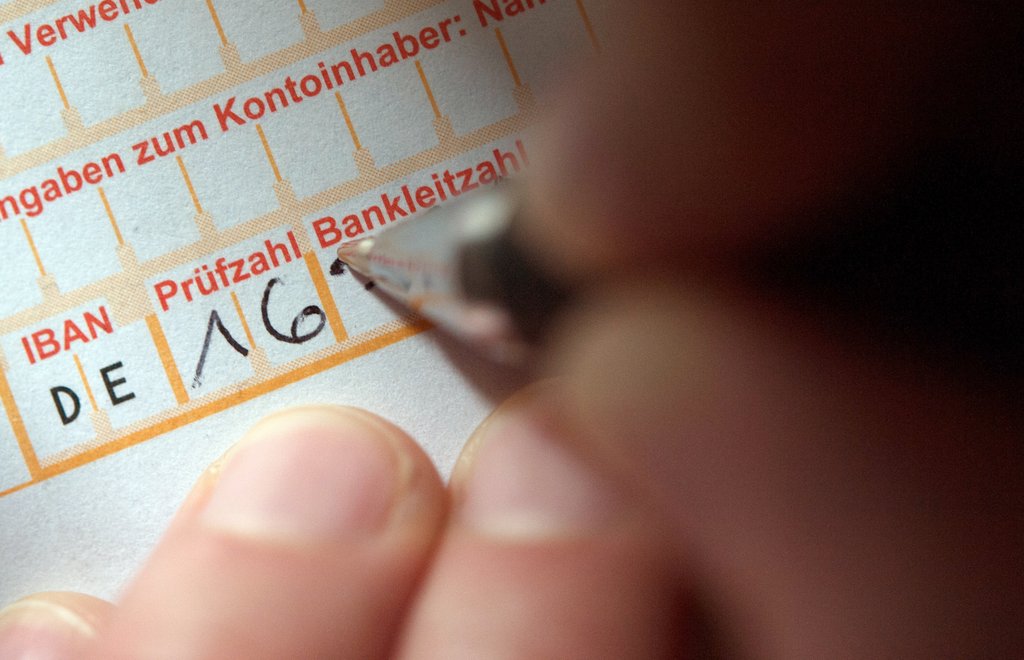 Überweisung. Foto: Marijan Murat/dpa